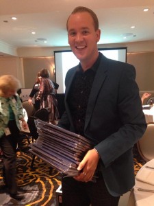 Travis Stanton of EXHIBITOR magazine shows off his Upper Midwest Regional Azbees